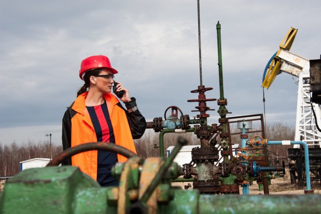 female engineer on walkie talkie in work field